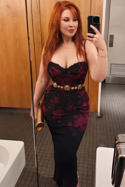 Woman wearing a figure flattering Harmony Bodycon Midi Dress - Classic Black BODYCON COLLECTION