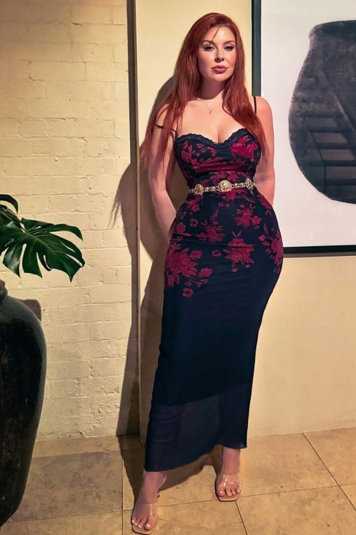 Woman wearing a figure flattering Harmony Bodycon Midi Dress - Classic Black BODYCON COLLECTION