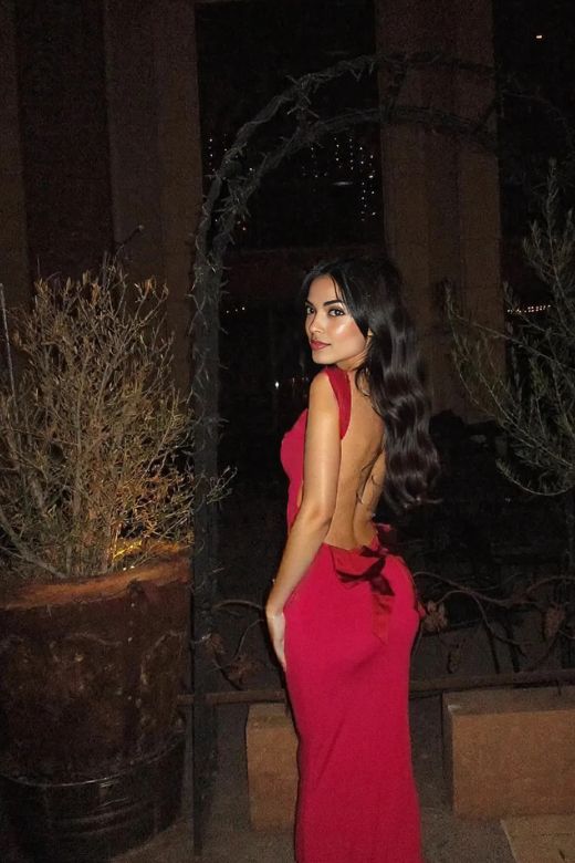 Woman wearing a figure flattering Harper Bodycon Maxi Dress - Lipstick Red BODYCON COLLECTION