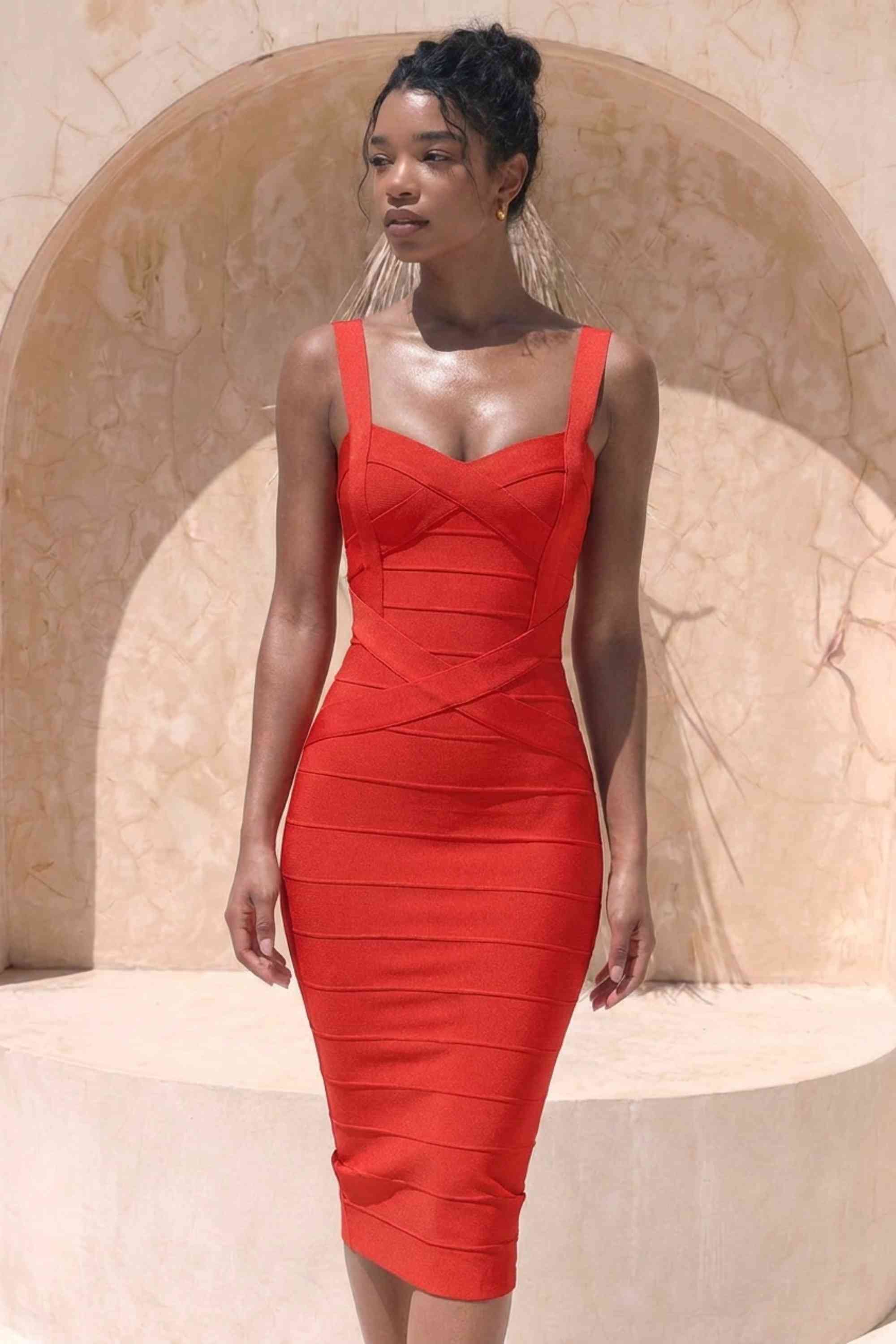 Woman wearing a figure flattering Heidi Bandage Midi Dress - Lipstick Red Bodycon Collection