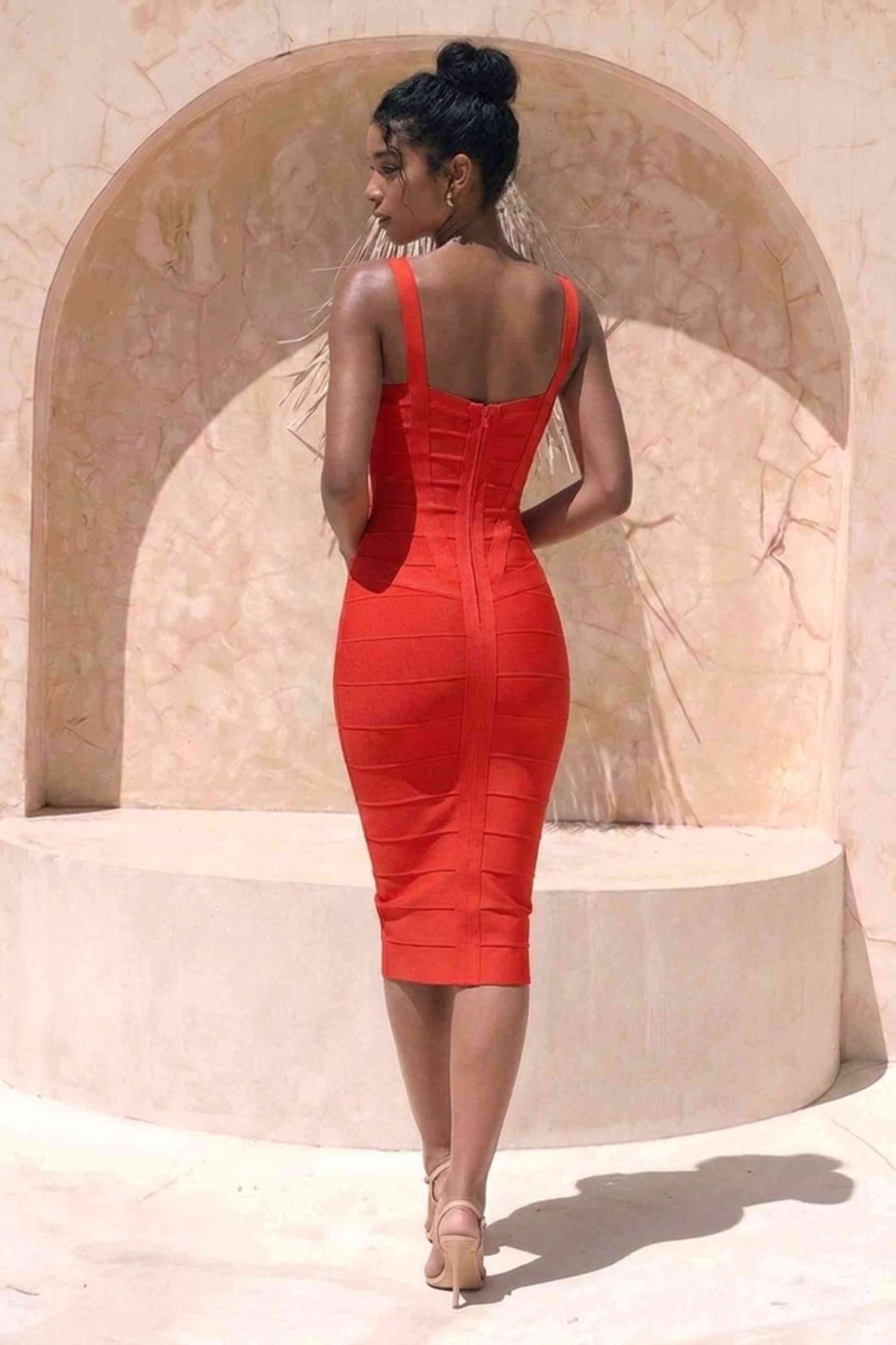 Woman wearing a figure flattering Heidi Bandage Midi Dress - Lipstick Red Bodycon Collection