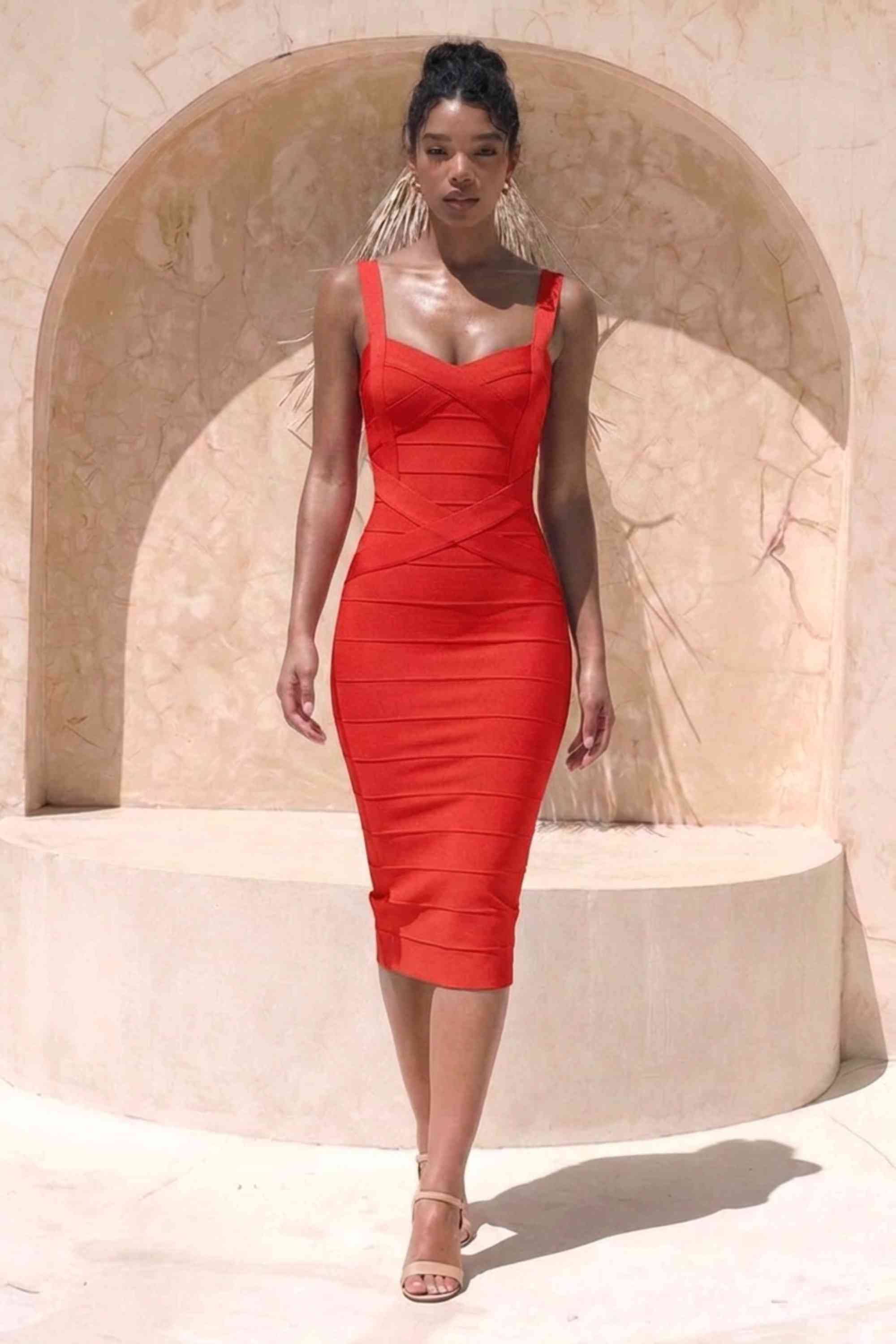 Woman wearing a figure flattering Heidi Bandage Midi Dress - Lipstick Red Bodycon Collection