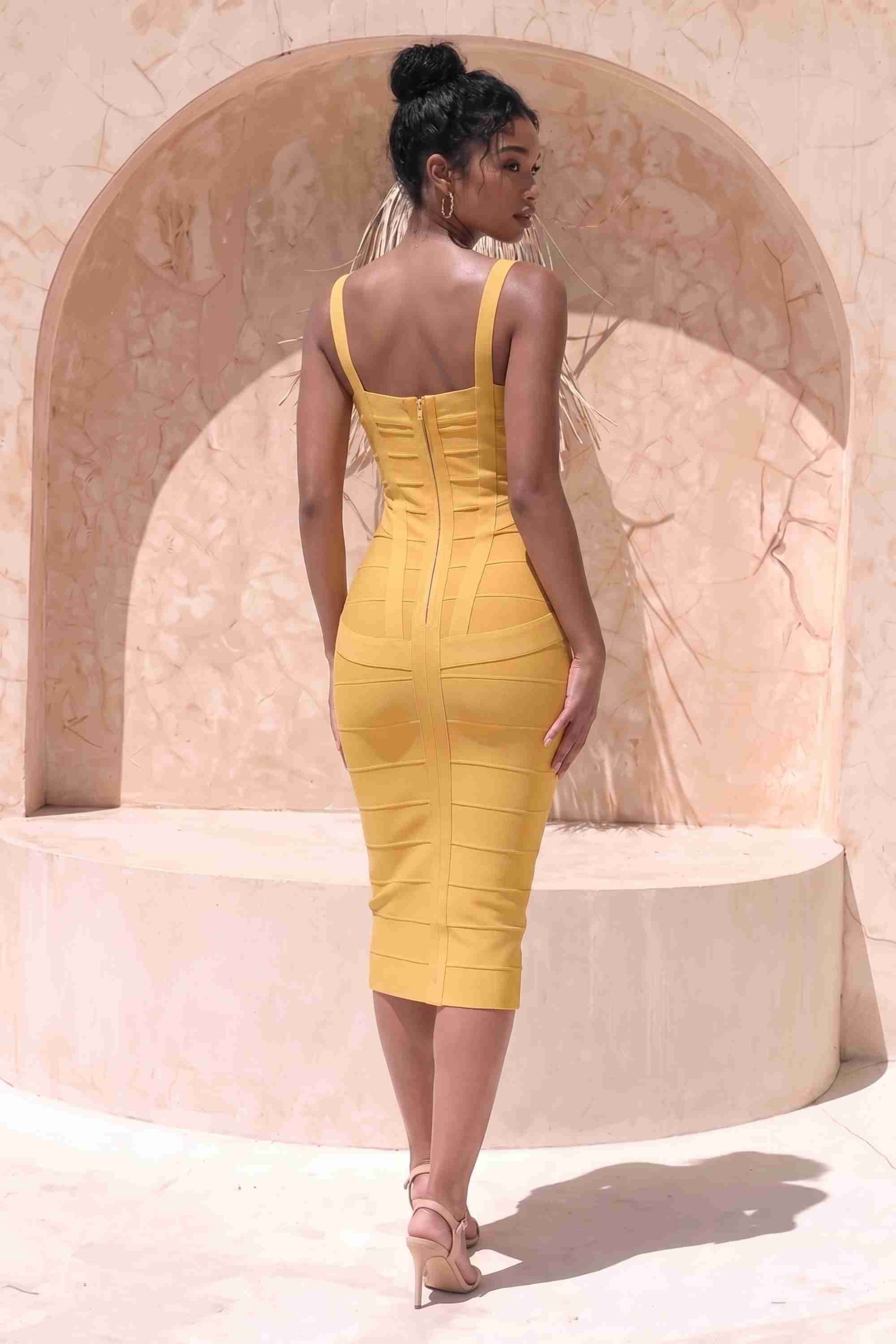 Woman wearing a figure flattering mustard yellow party dress Heidi Bandage Midi Dress - Mustard Yellow Bodycon Collection