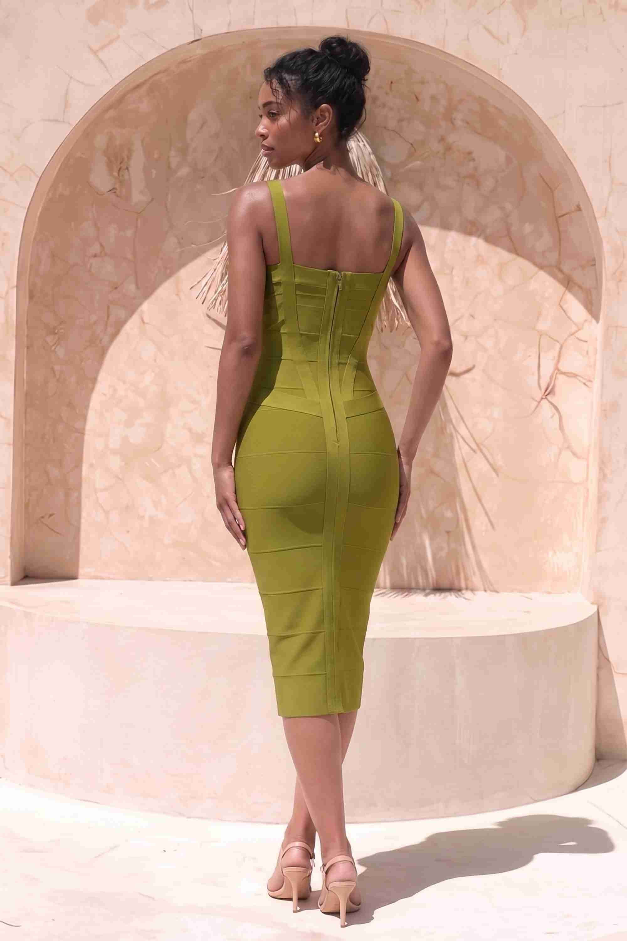 Woman wearing a figure flattering Heidi Bandage Midi Dress - Olive Green Bodycon Collection
