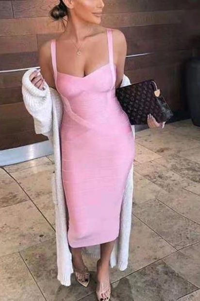 Woman wearing a figure flattering Heidi Bandage Midi Dress - Pearl White Bodycon Collection