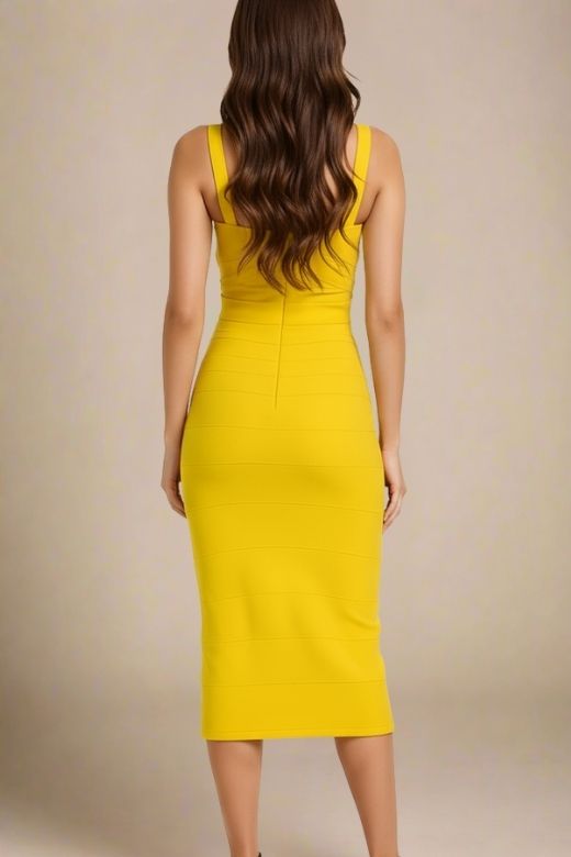 Woman wearing a figure flattering Heidi Bandage Midi Dress - Sun Yellow Bodycon Collection