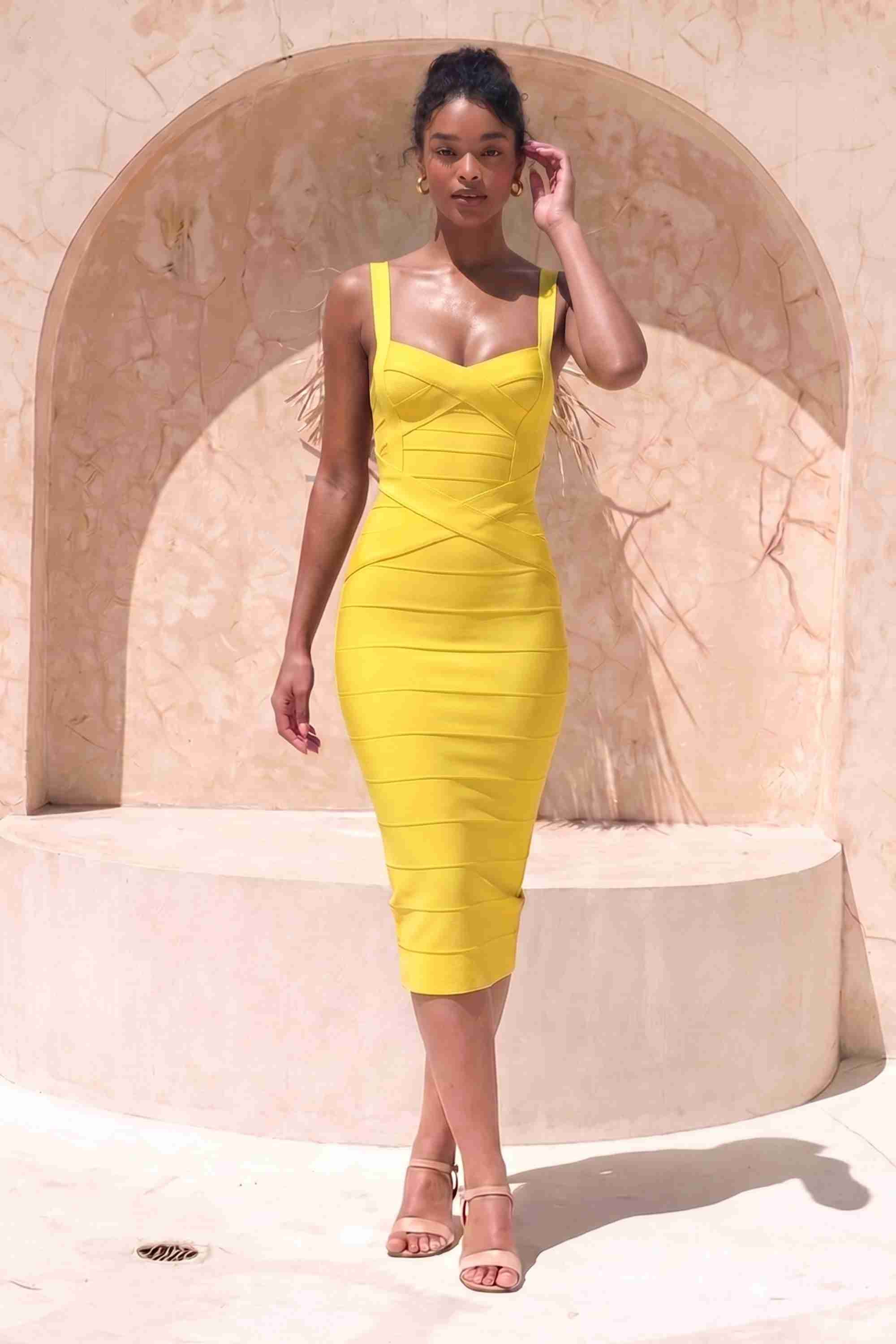 Woman wearing a yellow party dress Heidi Bandage Midi Dress - Sun Yellow Bodycon Collection
