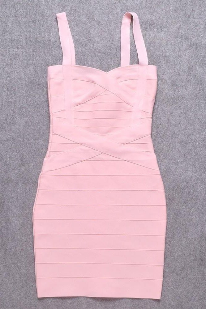 Woman wearing a figure flattering Heidi Bandage Mini Dress - Dusty Pink Bodycon Collection