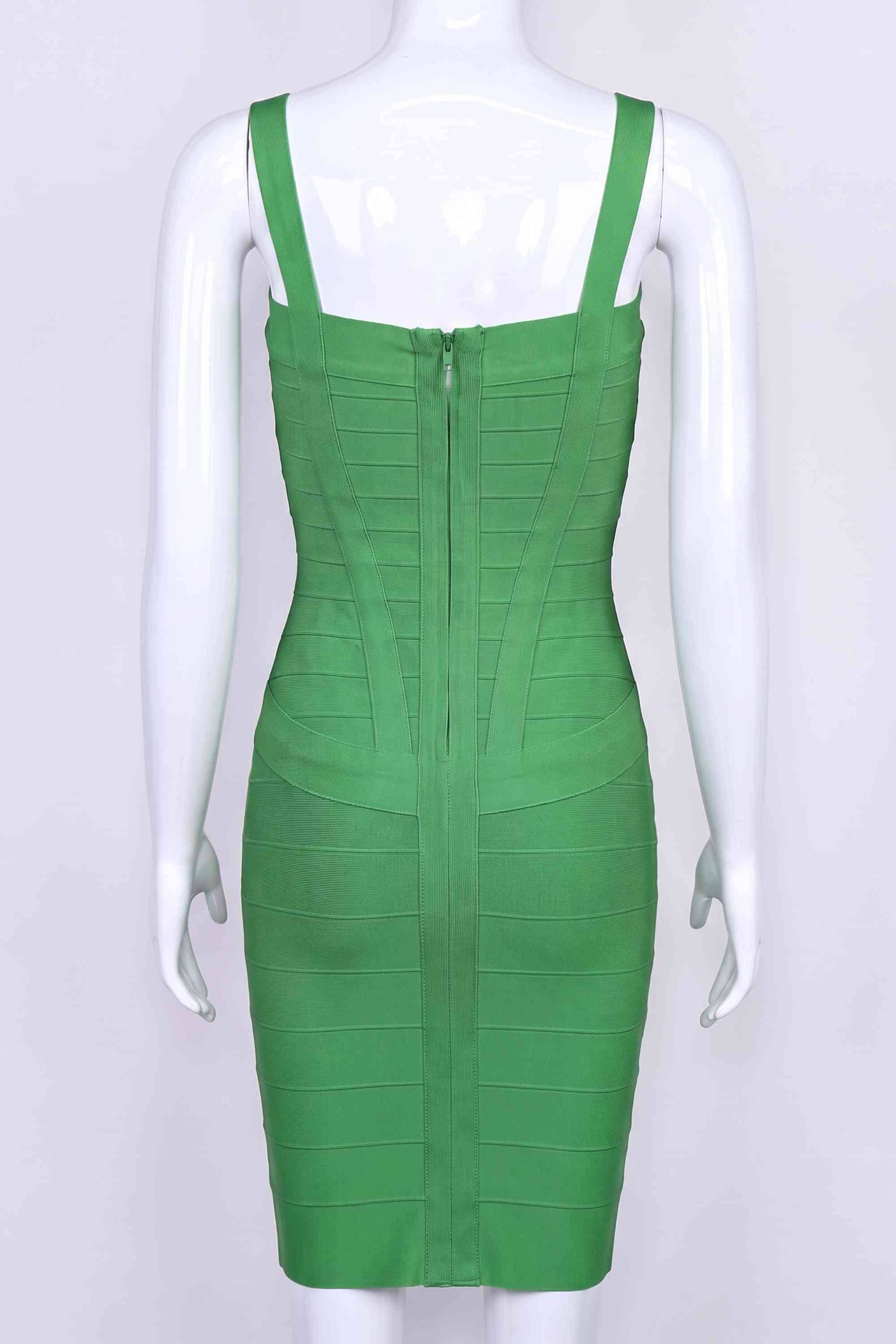 Woman wearing a figure flattering Heidi Bandage Mini Dress - Emerald Green Bodycon Collection