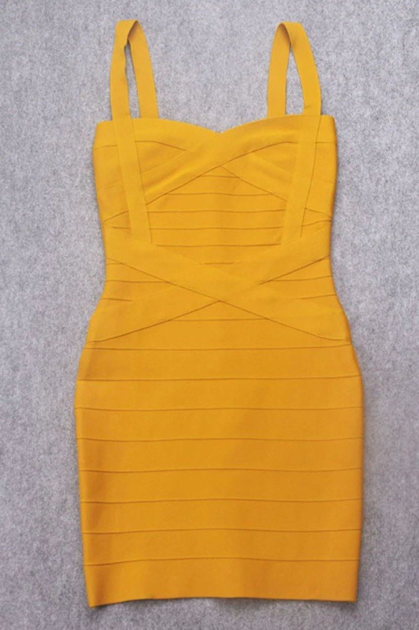 Woman wearing a figure flattering Heidi Bandage Mini Dress - Mustard Yellow Bodycon Collection