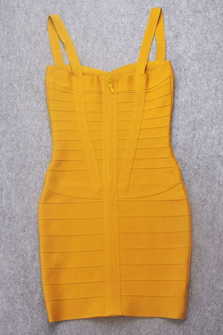 Woman wearing a figure flattering Heidi Bandage Mini Dress - Mustard Yellow Bodycon Collection