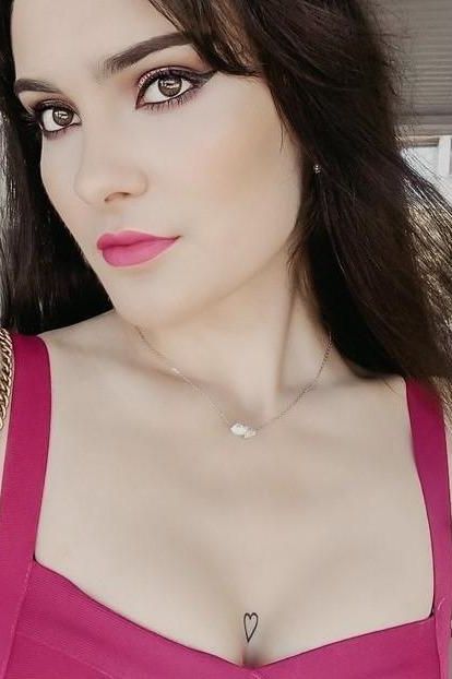 Woman wearing a figure flattering Heidi Bandage Mini Dress - Sun Yellow Bodycon Collection