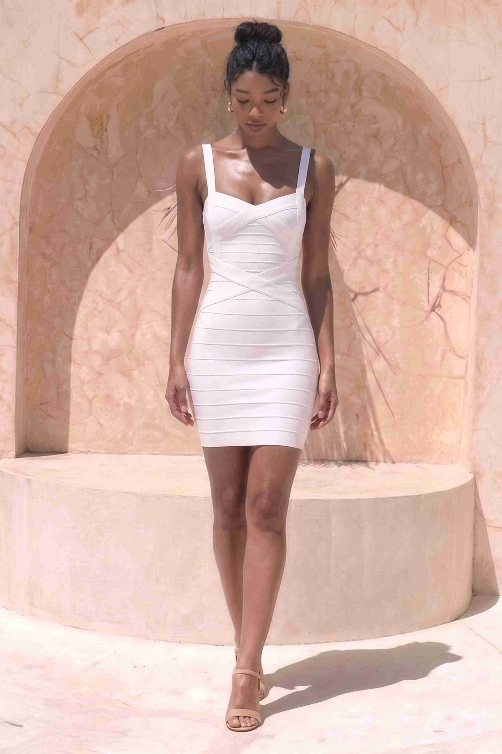 Woman wearing a figure flattering Heidi Bandage Mini Dress - White Pearl Bodycon Collection