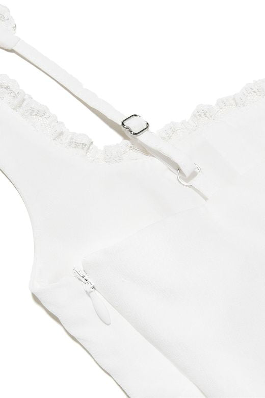 Woman wearing a figure flattering Adelyn Bodycon Mini Dress - Pearl White BODYCON COLLECTION