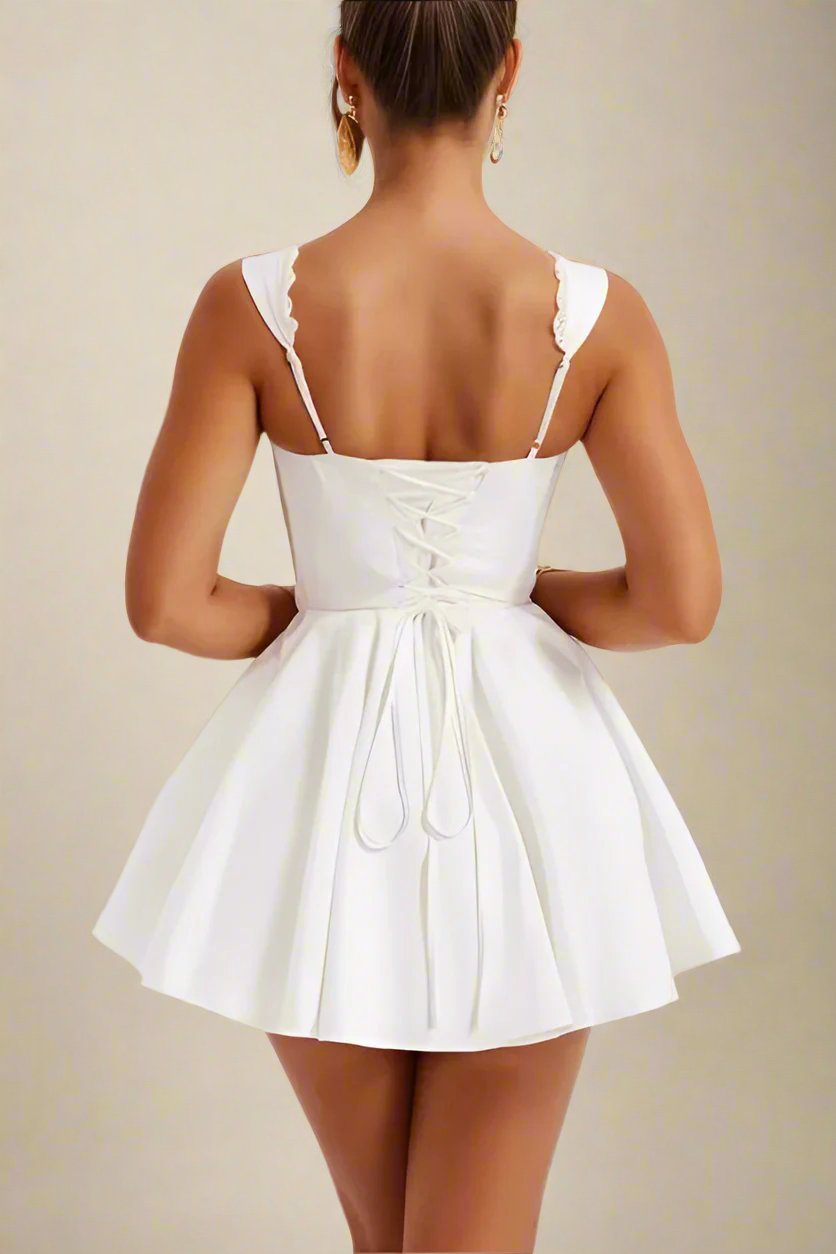 Woman wearing a figure flattering Adelyn Bodycon Mini Dress - Pearl White BODYCON COLLECTION