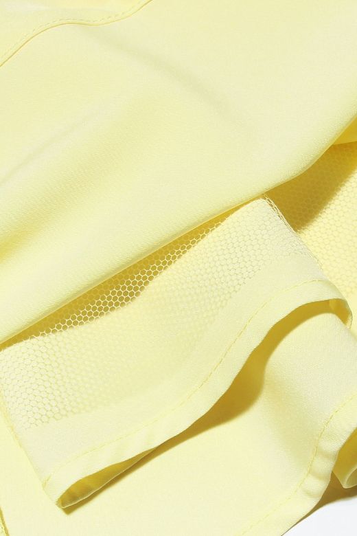 Woman wearing a figure flattering Adelyn Bodycon Mini Dress - Sun Yellow BODYCON COLLECTION