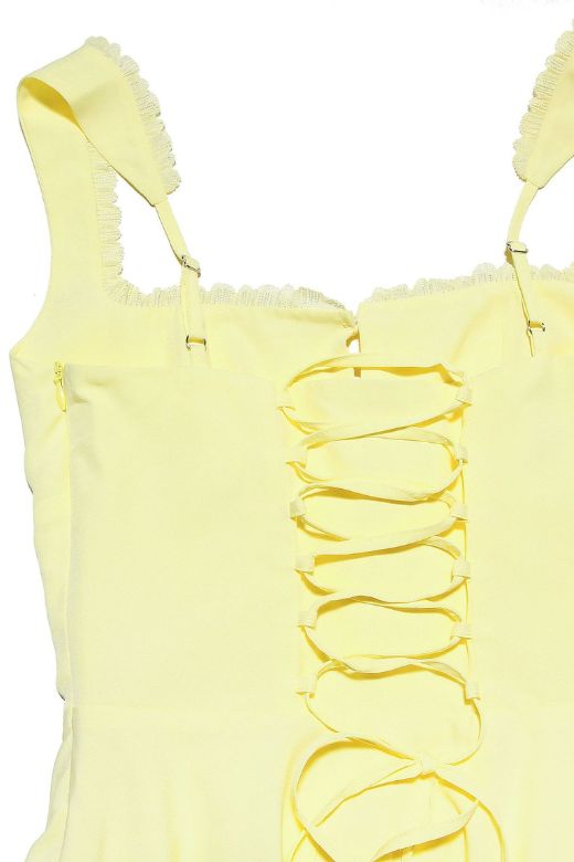 Woman wearing a figure flattering Adelyn Bodycon Mini Dress - Sun Yellow BODYCON COLLECTION