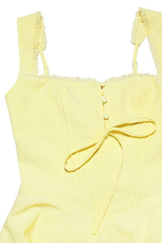 Woman wearing a figure flattering Adelyn Bodycon Mini Dress - Sun Yellow BODYCON COLLECTION