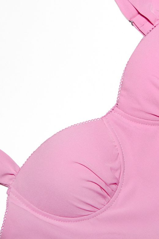 Woman wearing a figure flattering Imogen Bodycon Day Midi Dress - Blush Pink BODYCON COLLECTION