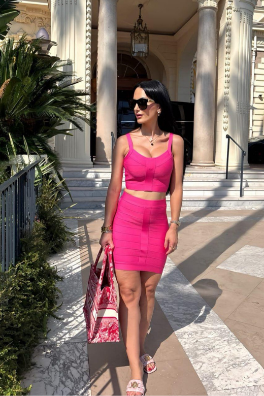 Woman wearing a figure flattering India Bandage Top and Mini Skirt Outfit Set - Hot Pink BODYCON COLLECTION