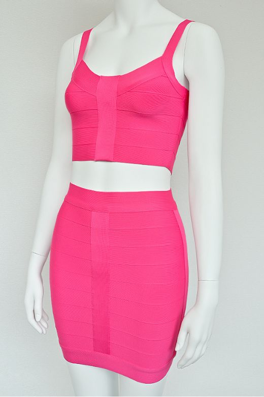 Woman wearing a figure flattering India Bandage Top and Mini Skirt Set - Hot Pink BODYCON COLLECTION