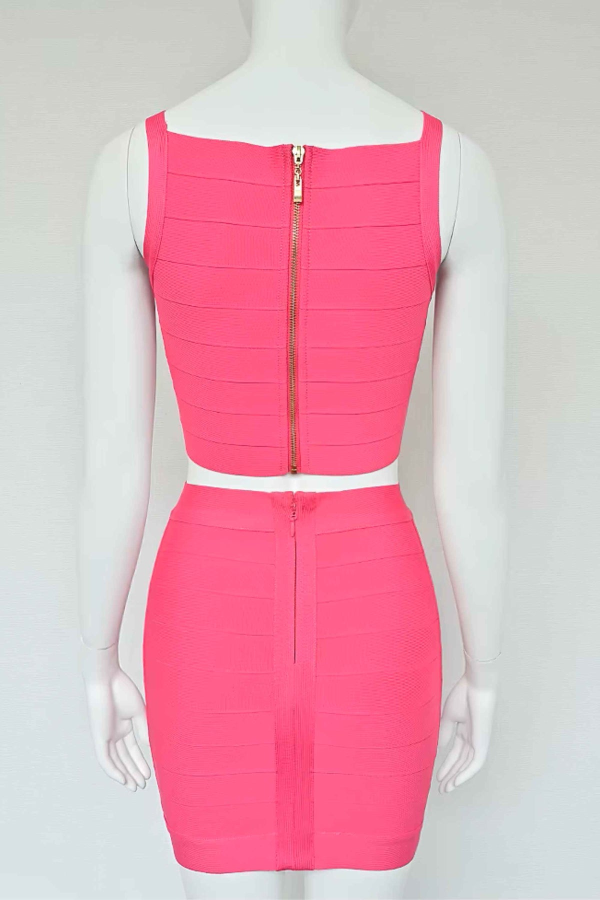 Woman wearing a figure flattering India Bandage Top and Mini Skirt Set - Hot Pink BODYCON COLLECTION
