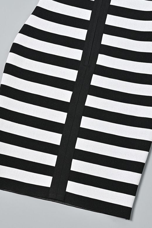 Woman wearing a figure flattering Ingrid Bandage Mini Dress - Classic Black BODYCON COLLECTION