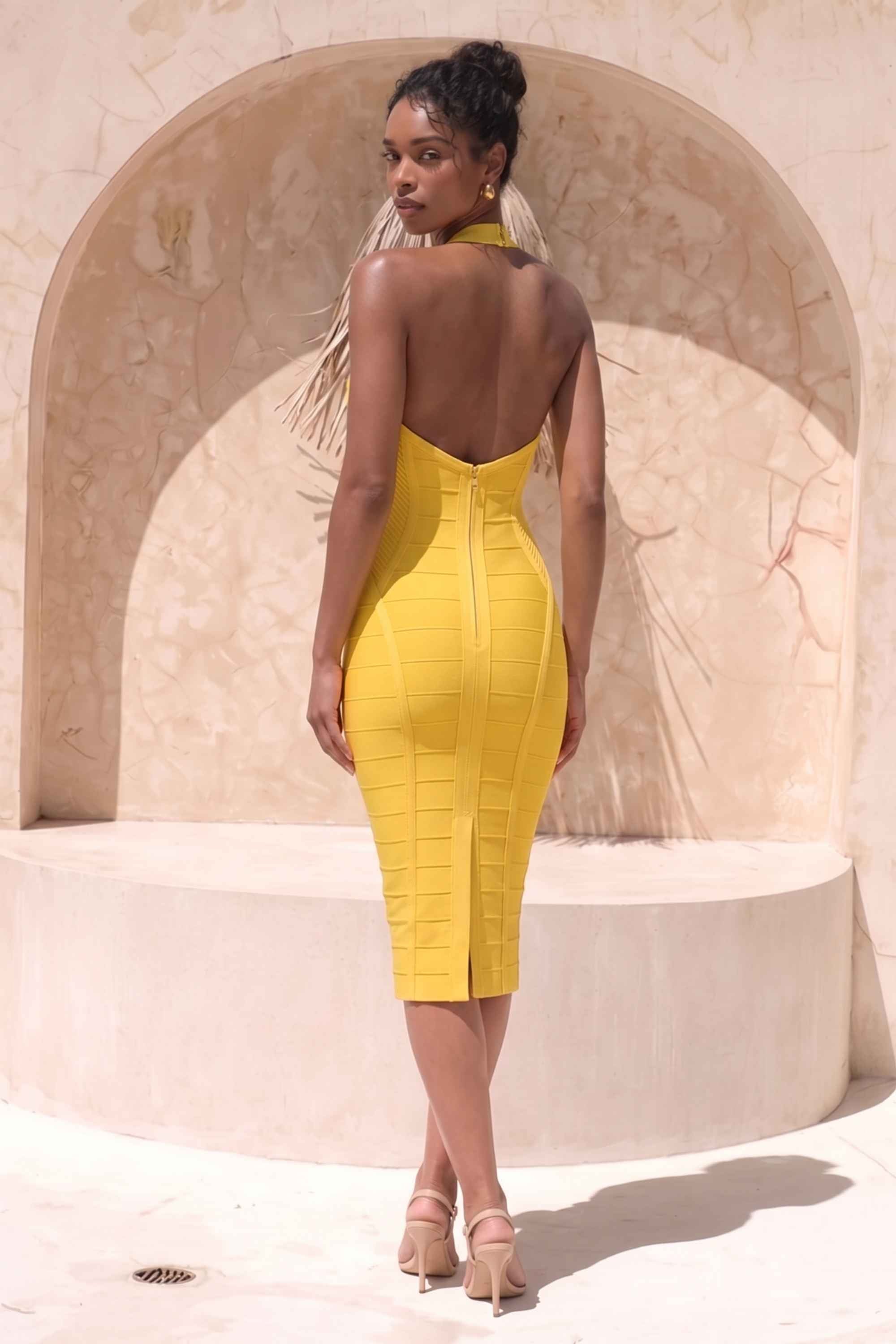 Woman wearing a figure flattering Isabella Bandage Midi Dress - Mustard Yellow BODYCON COLLECTION Pty Ltd