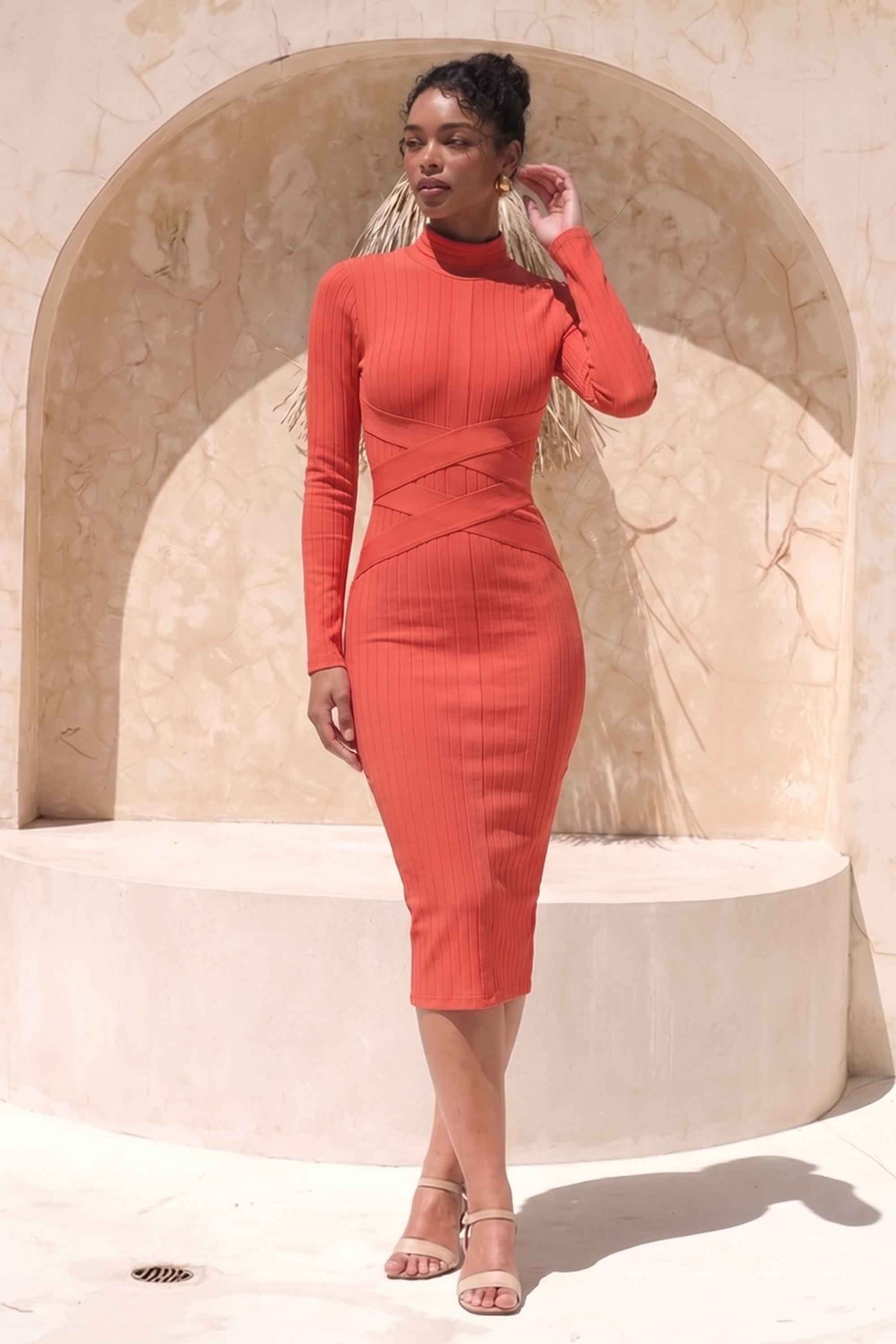 Woman wearing a figure flattering Jane Long Sleeve Bodycon Midi Dress - Lipstick Red Bodycon Collection