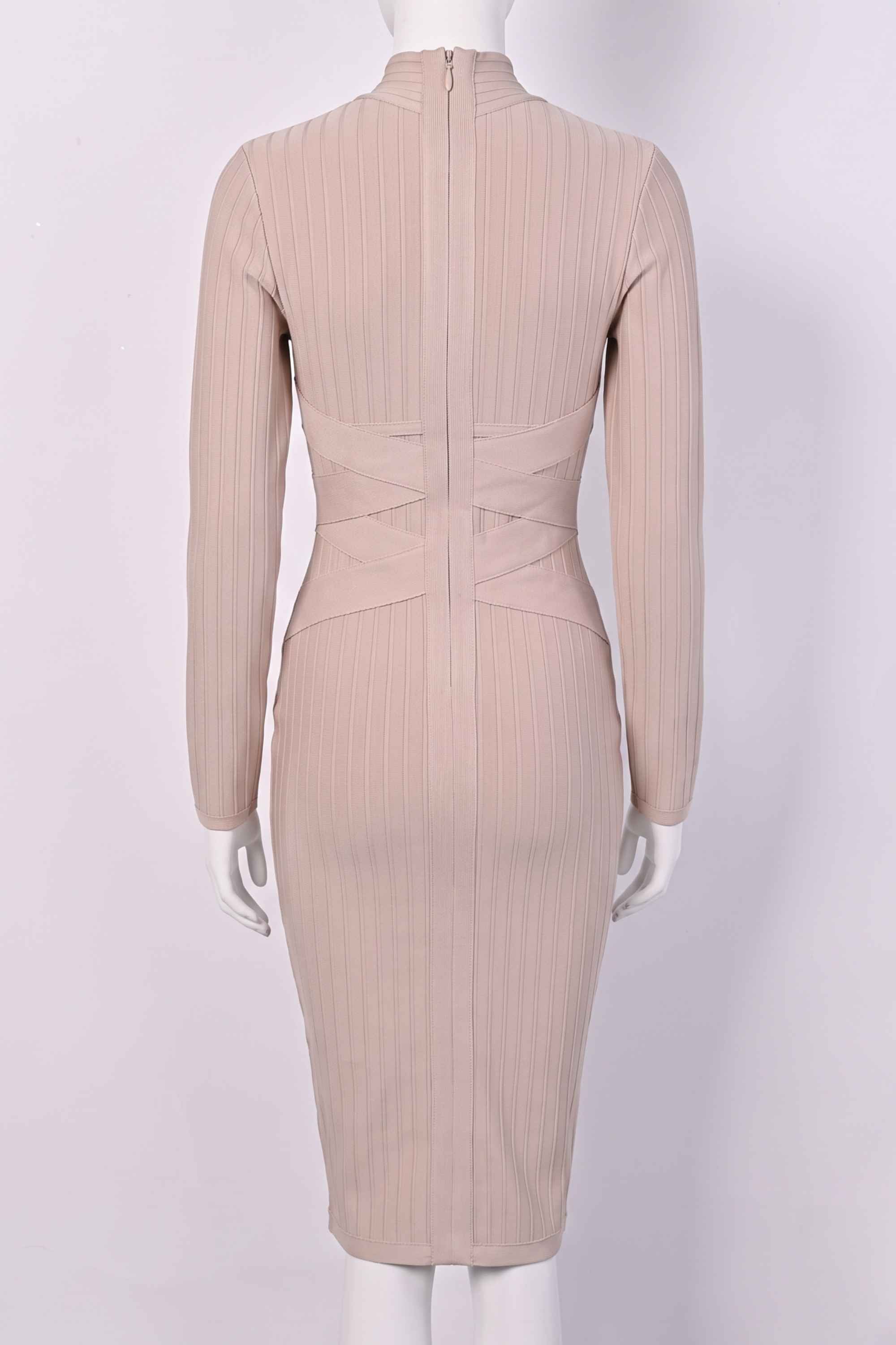Woman wearing a figure flattering Jane Long Sleeve Bodycon Midi Dress - Nude Bodycon Collection
