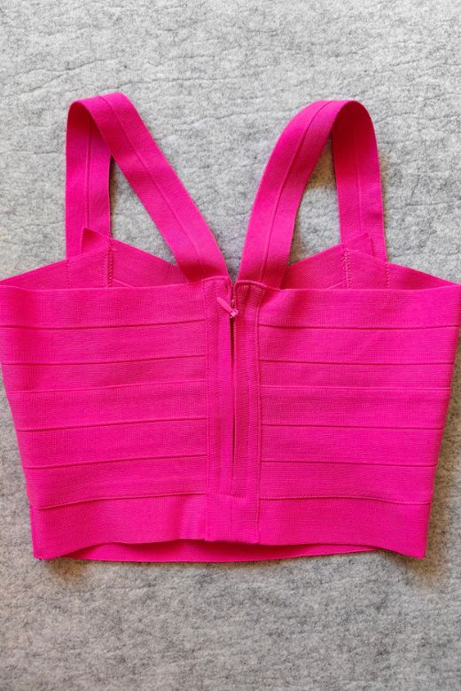 Woman wearing a figure flattering Jay Bandage Crop Top - Hot Pink BODYCON COLLECTION