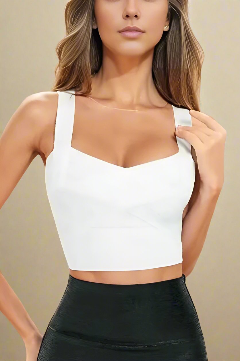 Woman wearing a figure flattering Jay Bandage Crop Top - Pearl White BODYCON COLLECTION