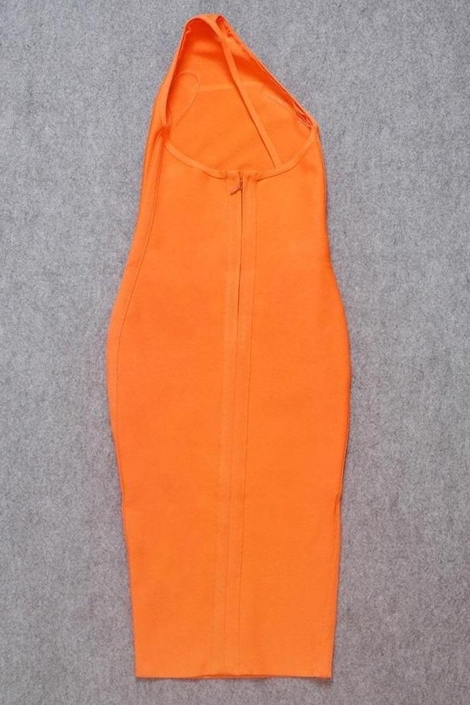 Woman wearing a figure flattering Joi Bodycon Midi Dress - Apricot Orange Bodycon Collection