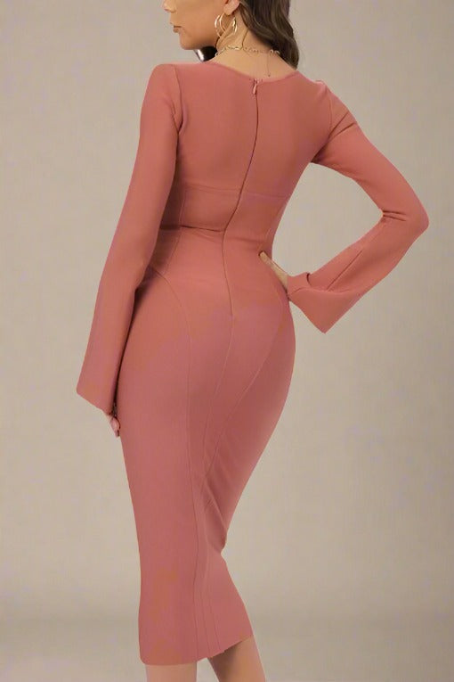 Woman wearing a figure flattering Jules Long Sleeve Midi Bandage Dress - Watermelon Pink BODYCON COLLECTION
