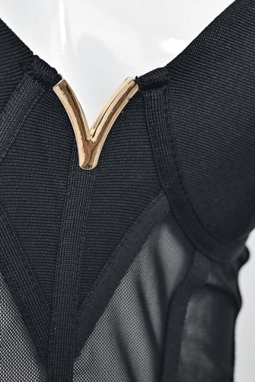 Woman wearing a figure flattering Juliette Bodycon Dress - Classic Black Bodycon Collection