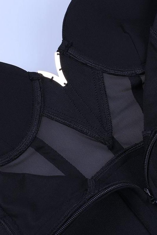 Woman wearing a figure flattering Juliette Bodycon Dress - Classic Black Bodycon Collection