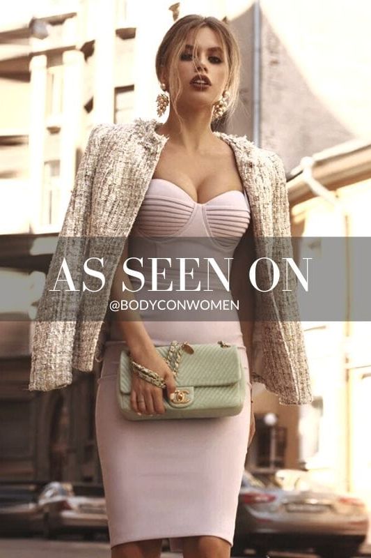 Woman wearing a figure flattering Kate Bandage Dress - Emerald Green Bodycon Collection