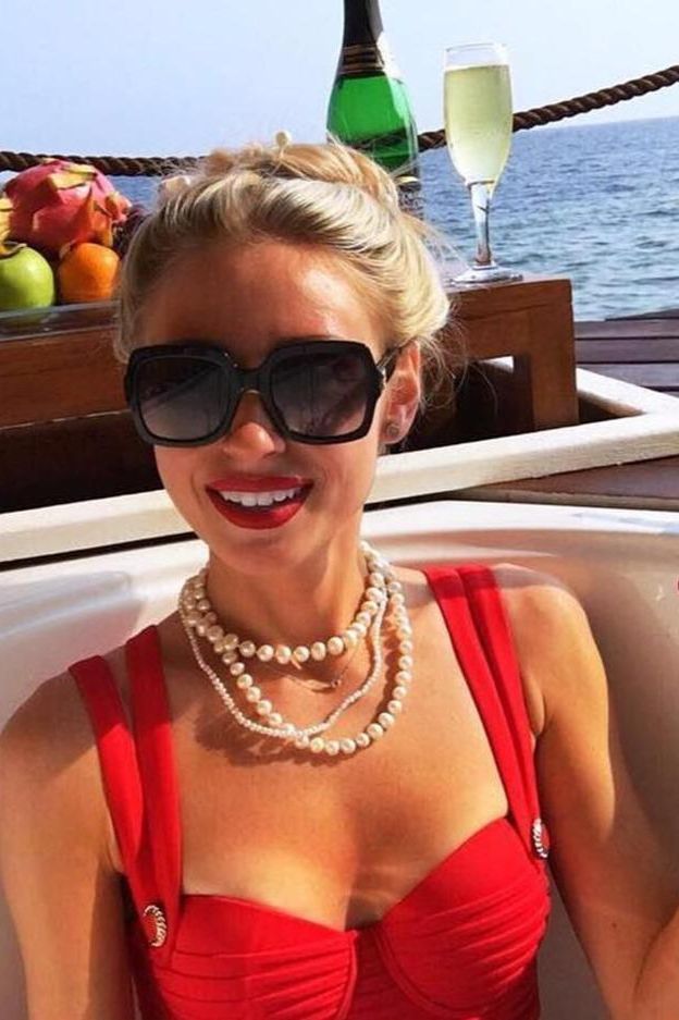 Woman wearing a figure flattering Kate Bandage Dress - Lipstick Red Bodycon Collection