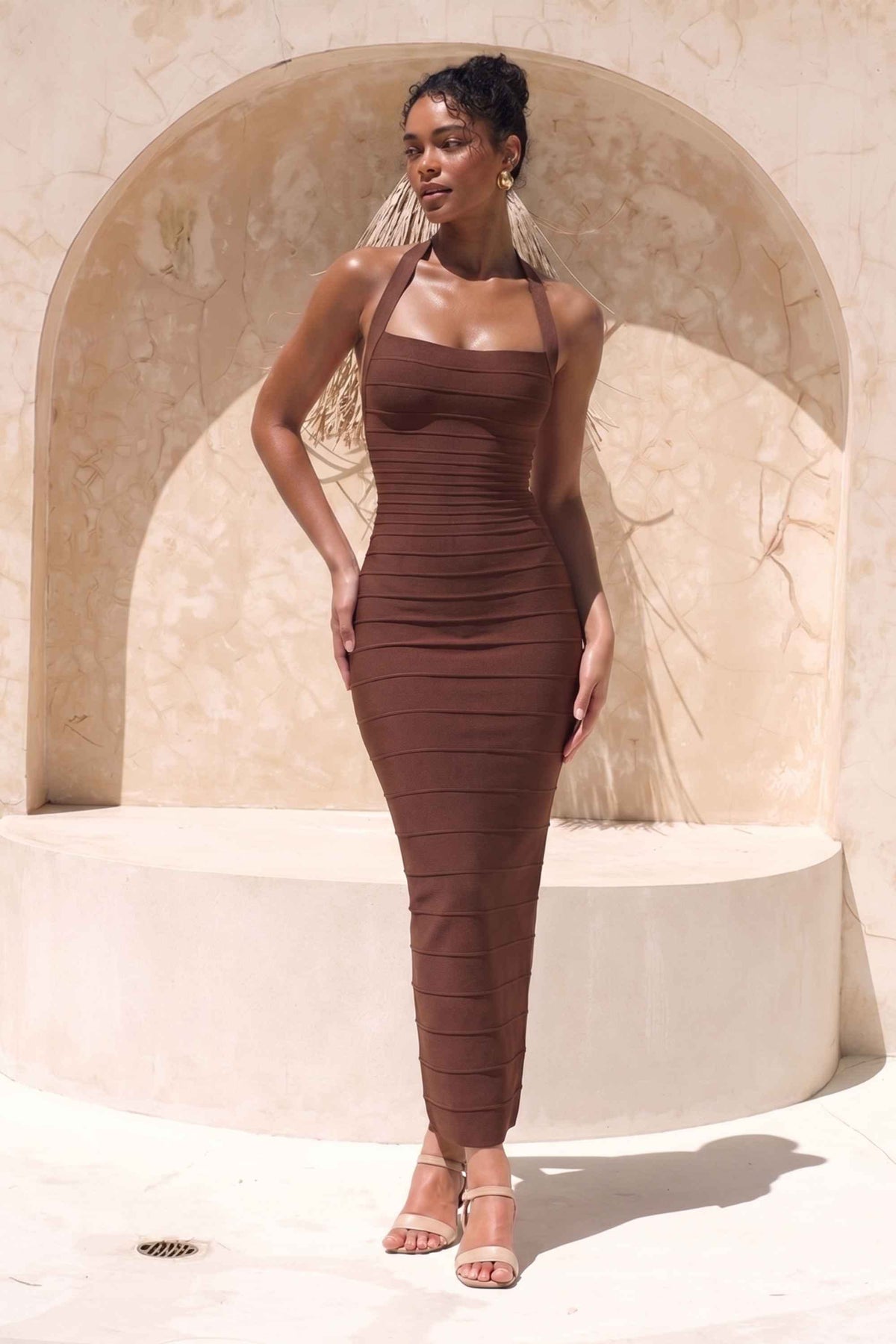 Woman wearing a figure flattering Kia Bandage Maxi Dress - Chocolate Brown BODYCON COLLECTION Pty Ltd