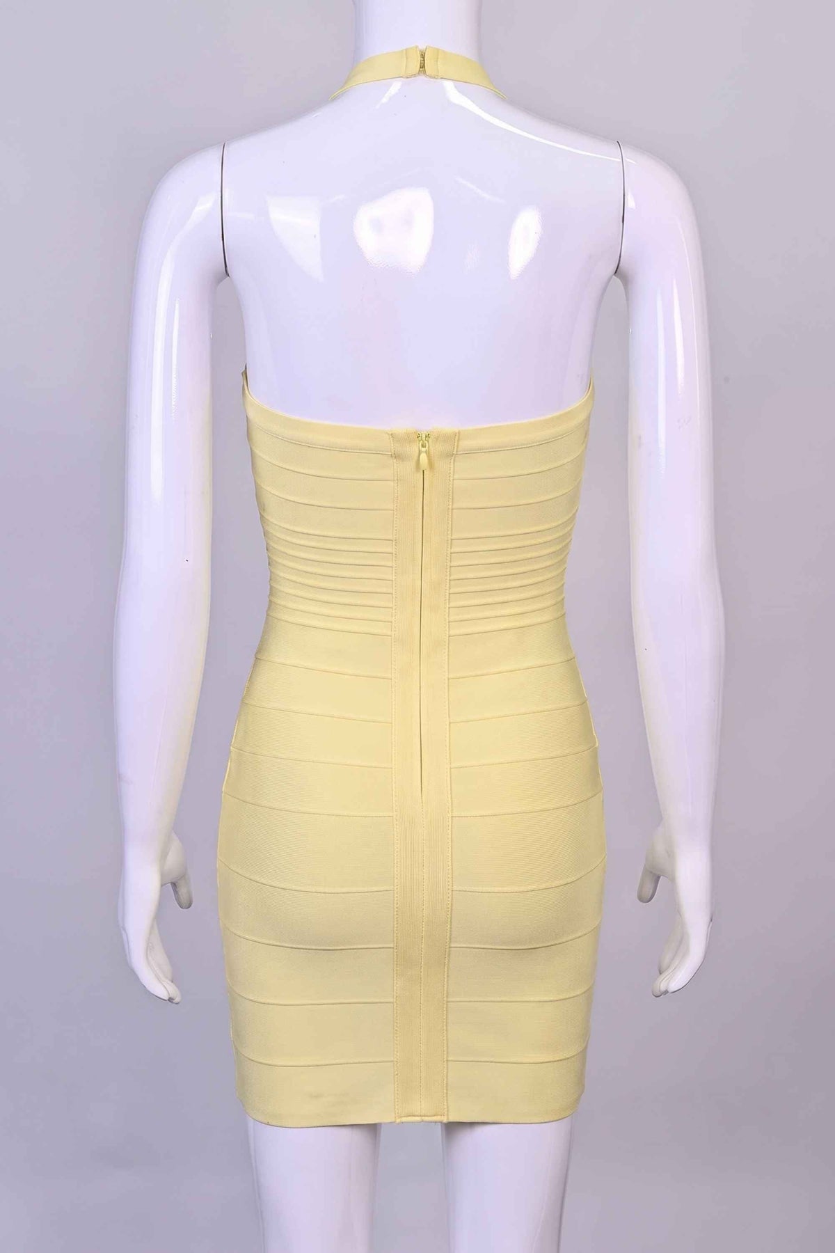 Woman wearing a figure flattering Kia Bandage Mini Dress - Butter Yellow BODYCON COLLECTION Pty Ltd