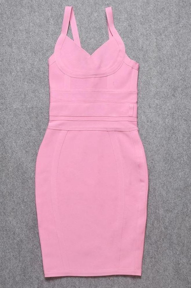 Woman wearing a figure flattering Kit Bandage Dress - Blush Pink Bodycon Collection