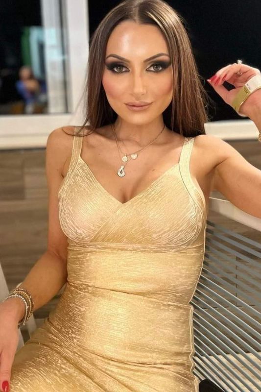 Woman wearing a figure flattering Kit Bandage Dress - Gold Bodycon Collection