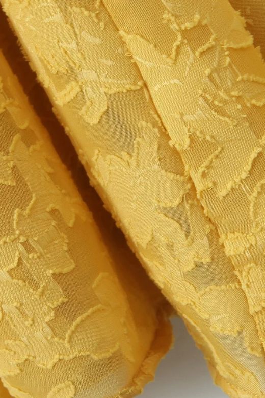 Woman wearing a figure flattering Kora Bodycon Maxi Dress - Lemon Yellow BODYCON COLLECTION