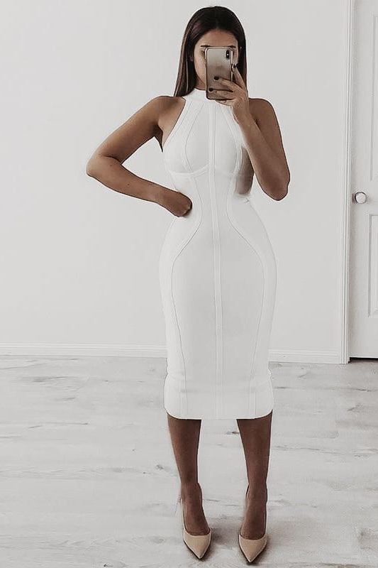 Woman wearing a figure flattering Lea Bandage Midi Dress - Nude Bodycon Collection