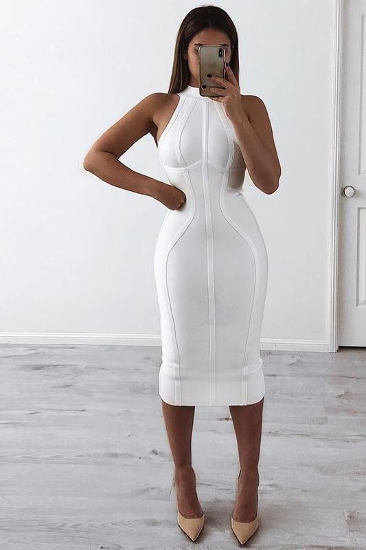 Woman wearing a figure flattering Lea Bandage Midi Dress - Pearl White Bodycon Collection