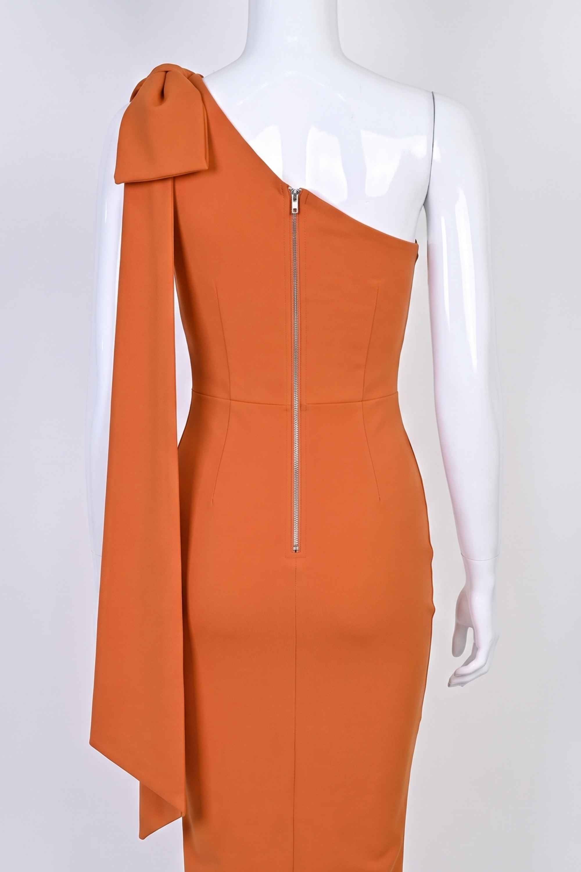 Woman wearing a figure flattering Lela Long Sleeve Bandage Midi Dress - Apricot Orange BODYCON COLLECTION