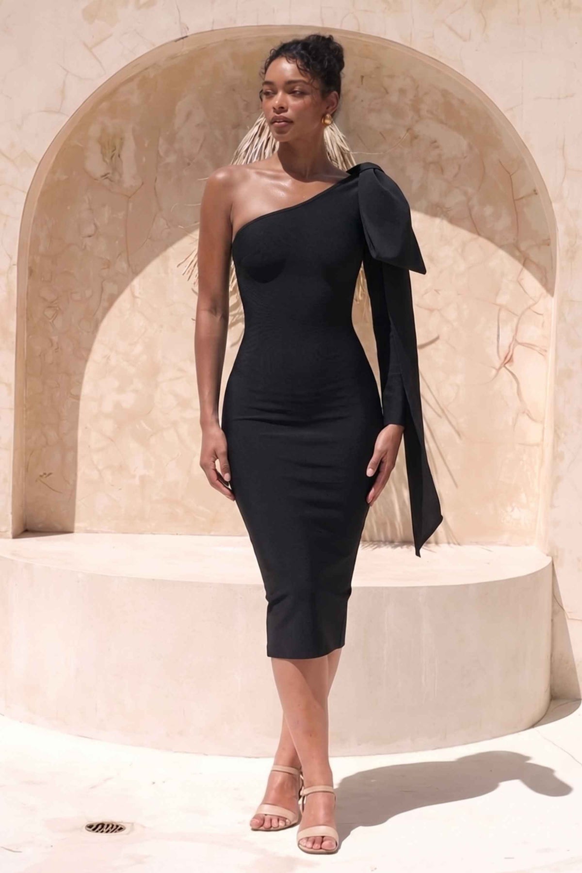 Woman wearing a figure flattering Lela Long Sleeve Bandage Midi Dress - Classic Black BODYCON COLLECTION