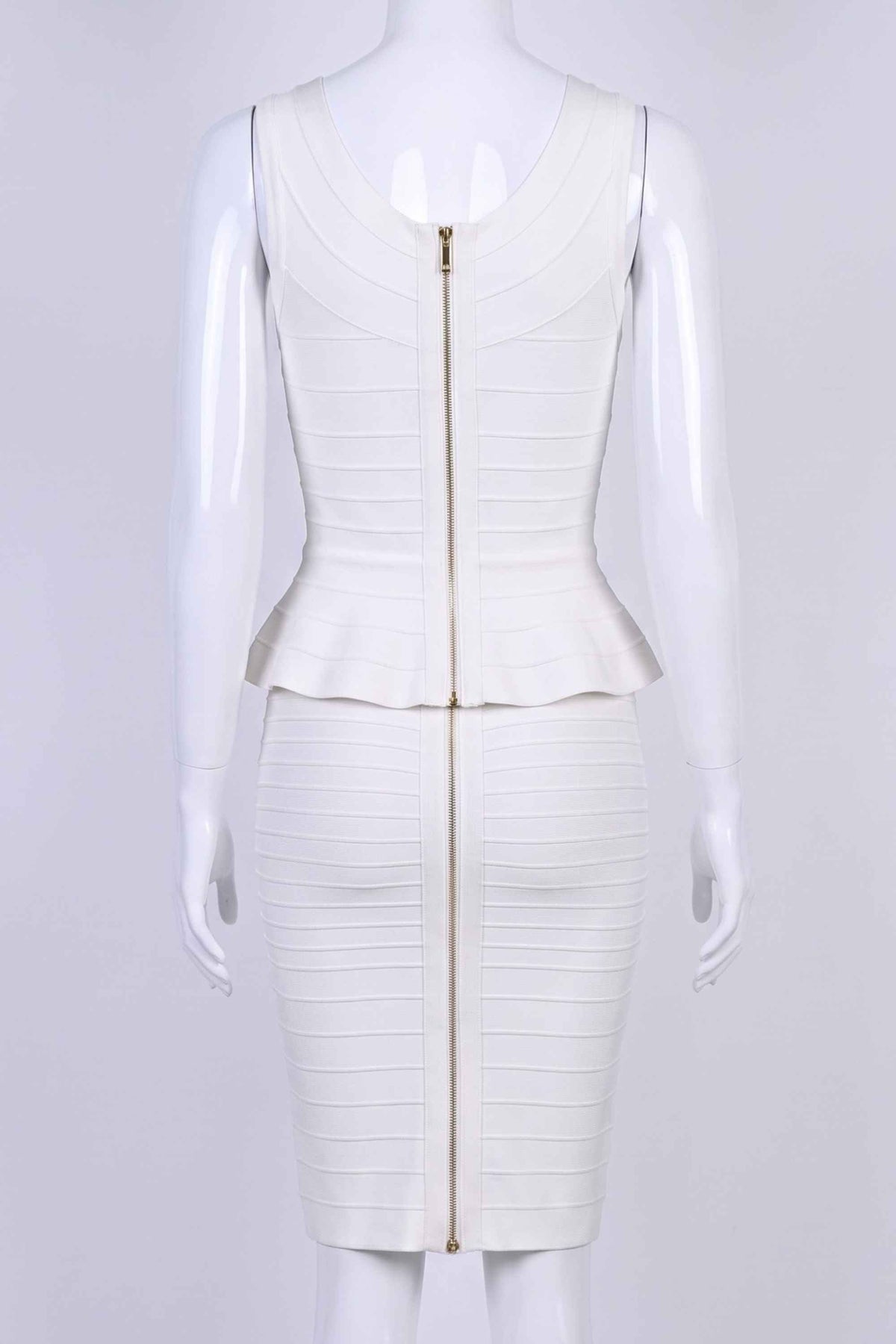 Woman wearing a figure flattering Leni Bandage Top and Knee Length Skirt Set - White Pearl BODYCON COLLECTION