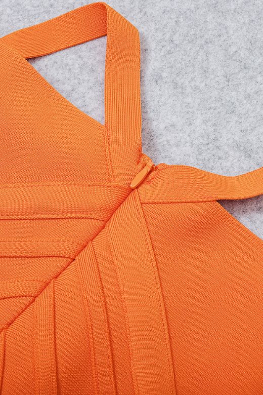 Woman wearing a figure flattering Leo Bandage Midi Dress - Apricot Orange Bodycon Collection