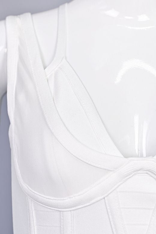 Woman wearing a figure flattering Lucy Bandage Midi Dress - White Pearl BODYCON COLLECTION